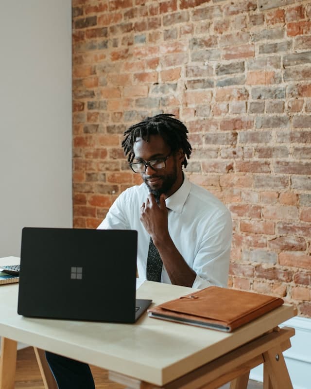 A founder working at a laptop